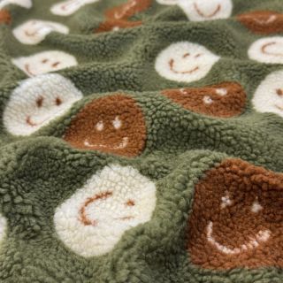 Coat fabric TEDDY JACQUARD Happy faces green