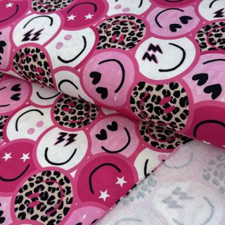Sweat fabric Happy faces pink digital print